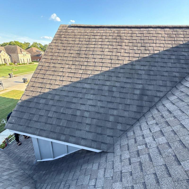Asphalt shingle roof surface with hail damage marks