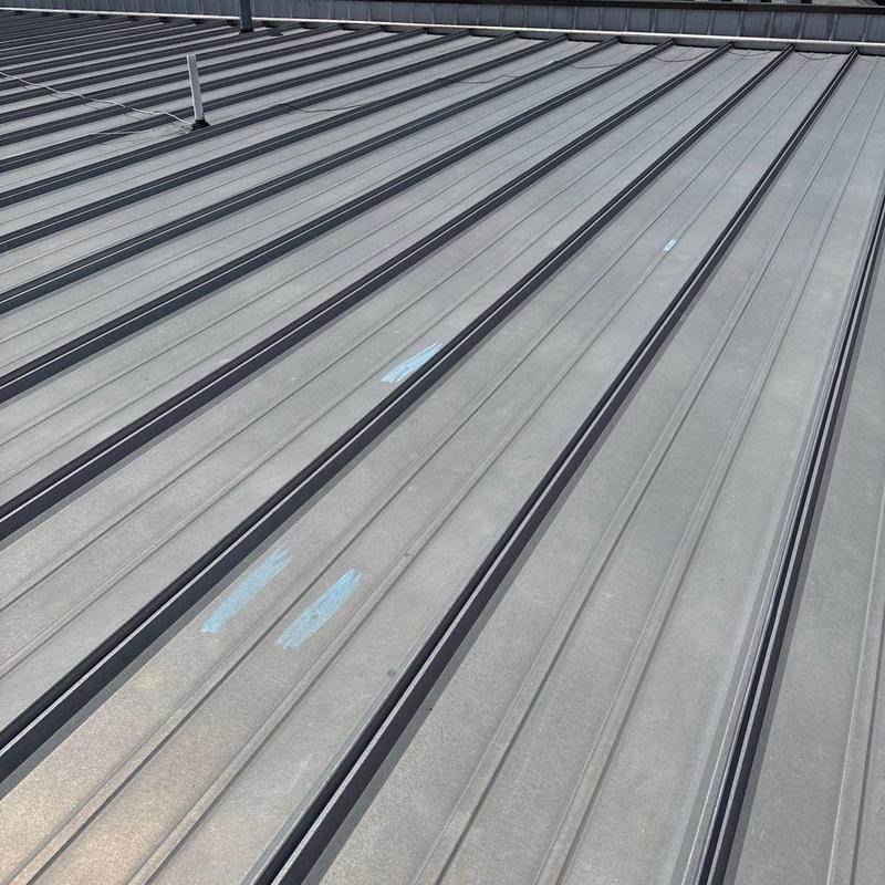 Metal roof panels with hail damage markings