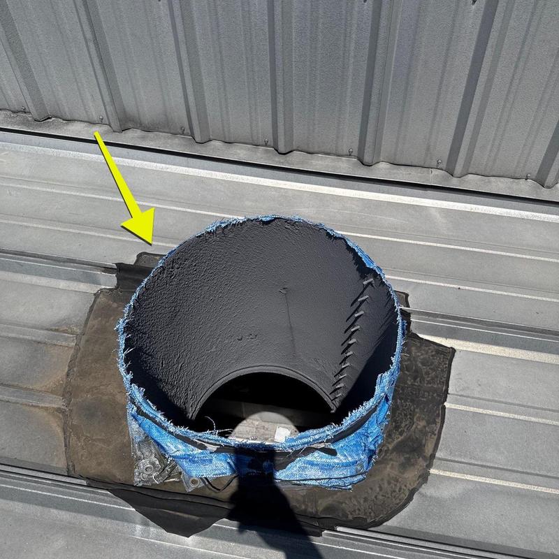 Metal roof vent pipe with damaged flashing and sealant