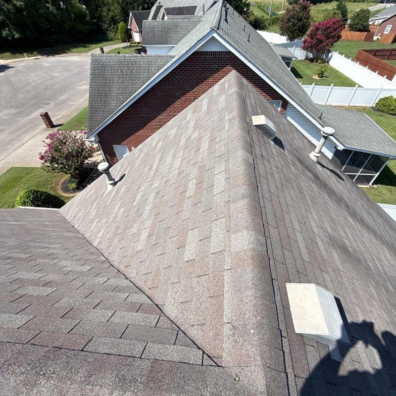 Asphalt shingle roof with vents and ridge cap
