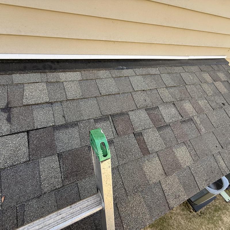 Asphalt shingle roof with drip edge and siding
