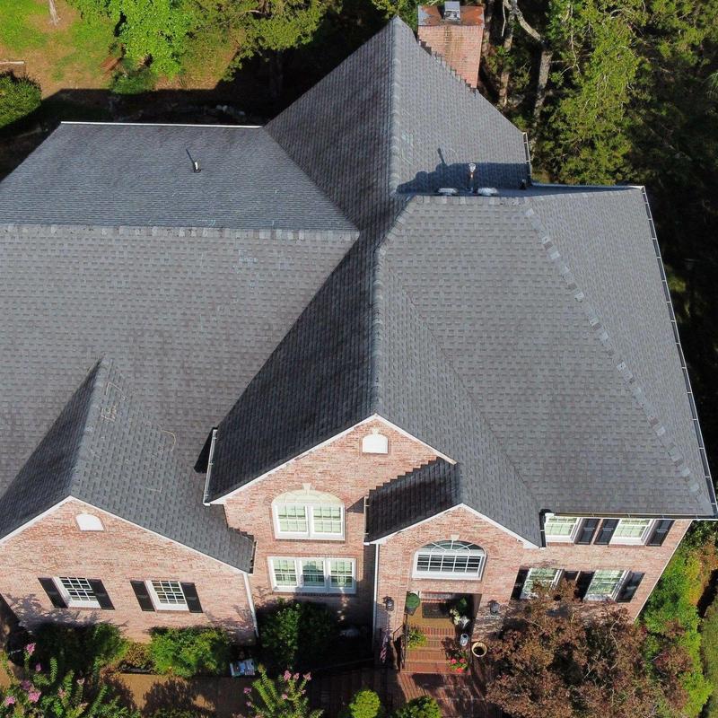 Asphalt shingle roof with hail damage inspection