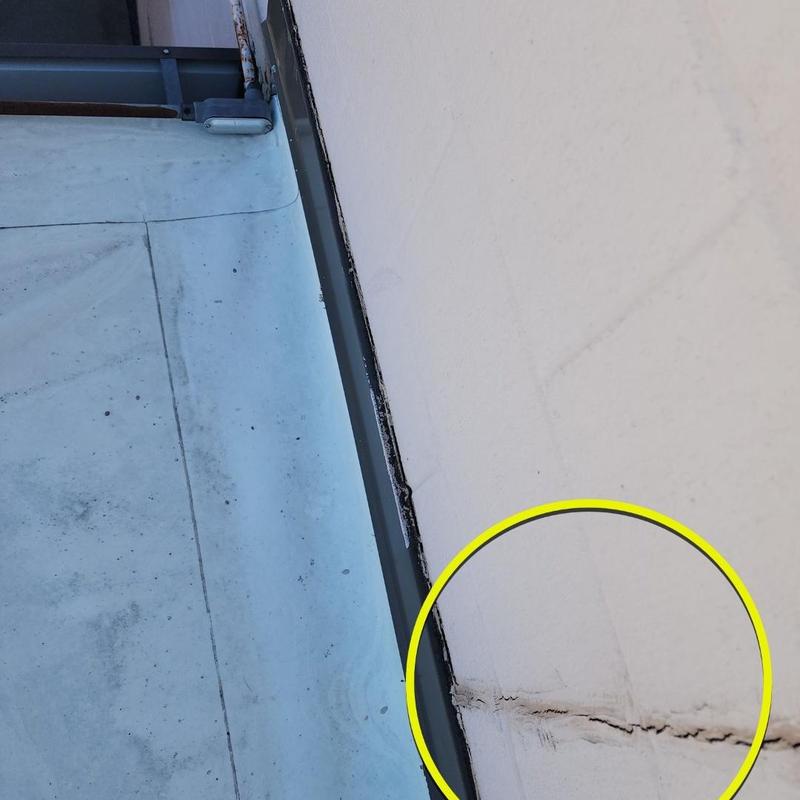 TPO roof membrane crack near metal flashing edge TPO roof membrane crack near metal flashing edge