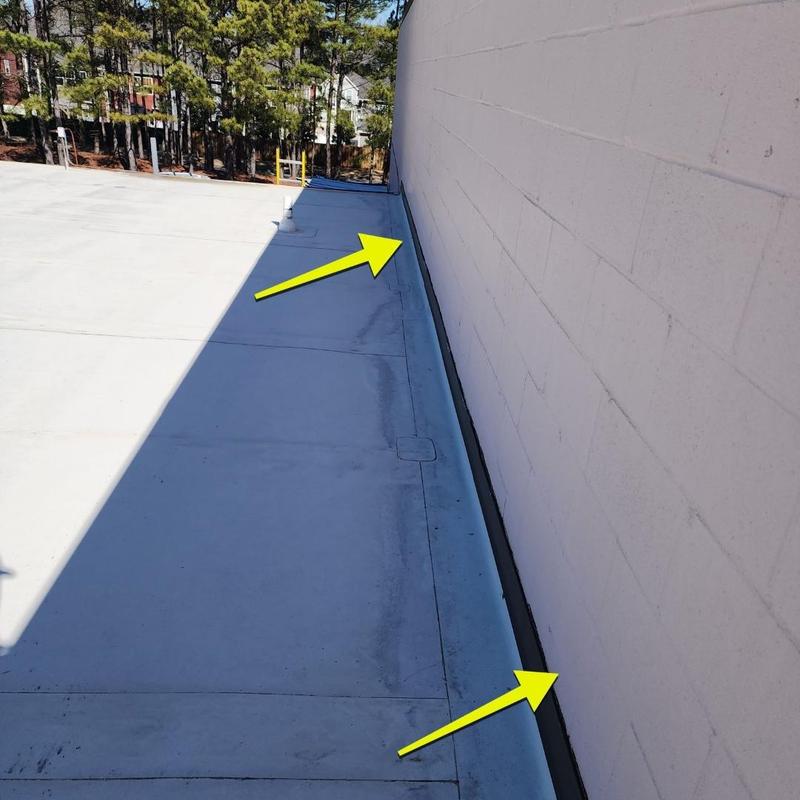 TPO flat roof edge flashing inspection with damage markers TPO flat roof edge flashing inspection with damage markers