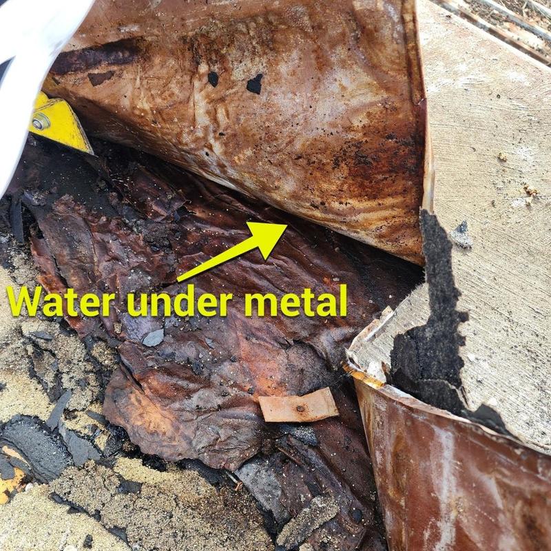Metal roofing with trapped water and damaged wood underneath Metal roofing with trapped water and damaged wood underneath