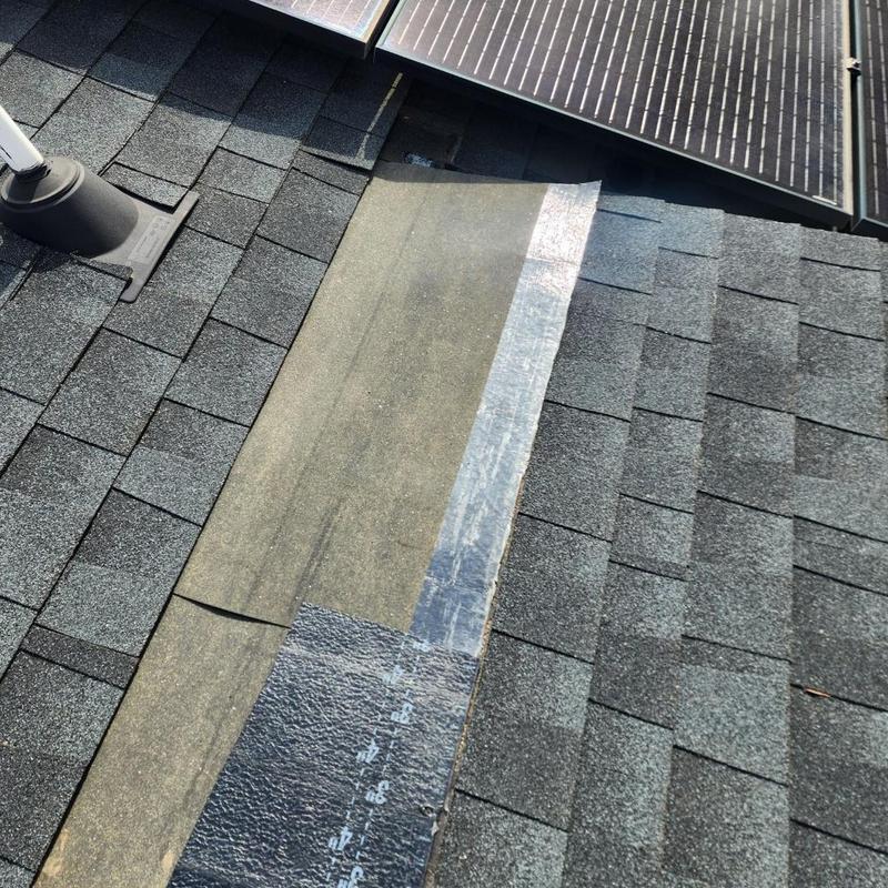 Roof shingles with underlayment patch near solar panels Roof shingles with underlayment patch near solar panels