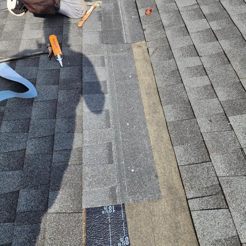 Asphalt shingles replacement on damaged residential roof Asphalt shingles replacement on damaged residential roof