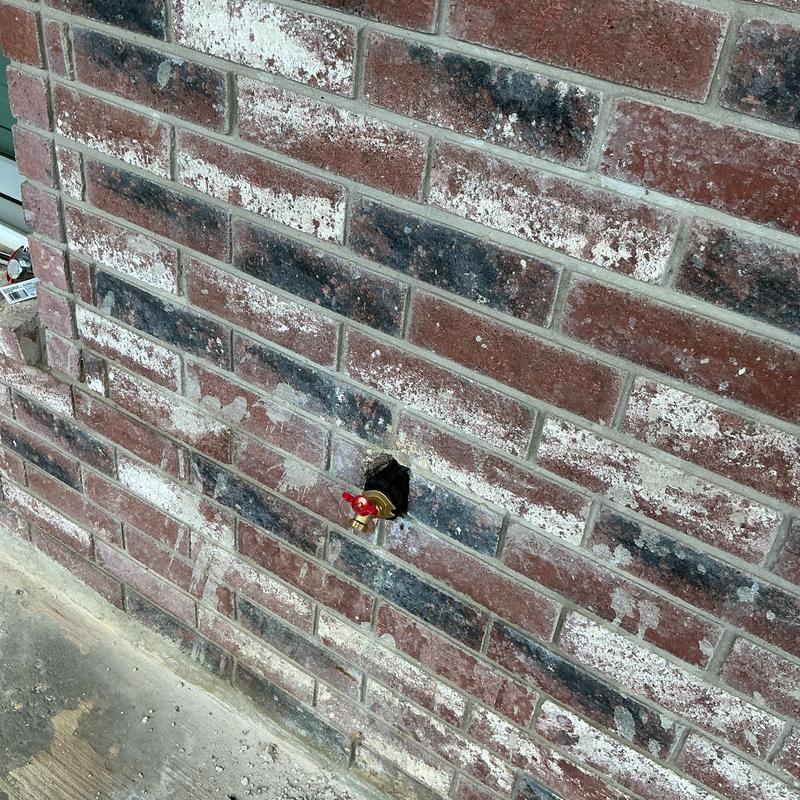 Isolation ball valve installed in brick wall access hole