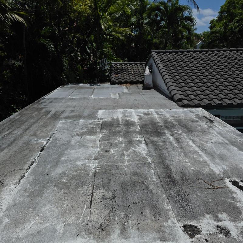 Flat tile roof with worn GAF capsheet system