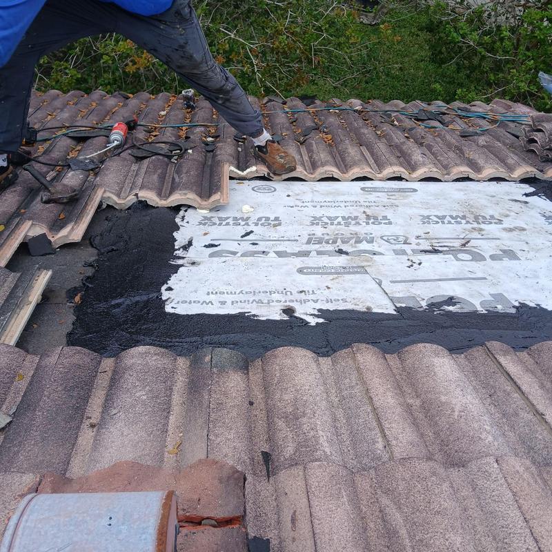 Tile roof underlayment installation during repair job Tile roof underlayment installation during repair job