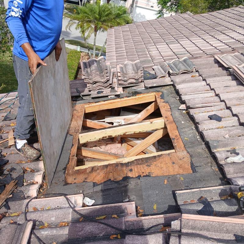 Tile roof framing exposed during repair work Tile roof framing exposed during repair work