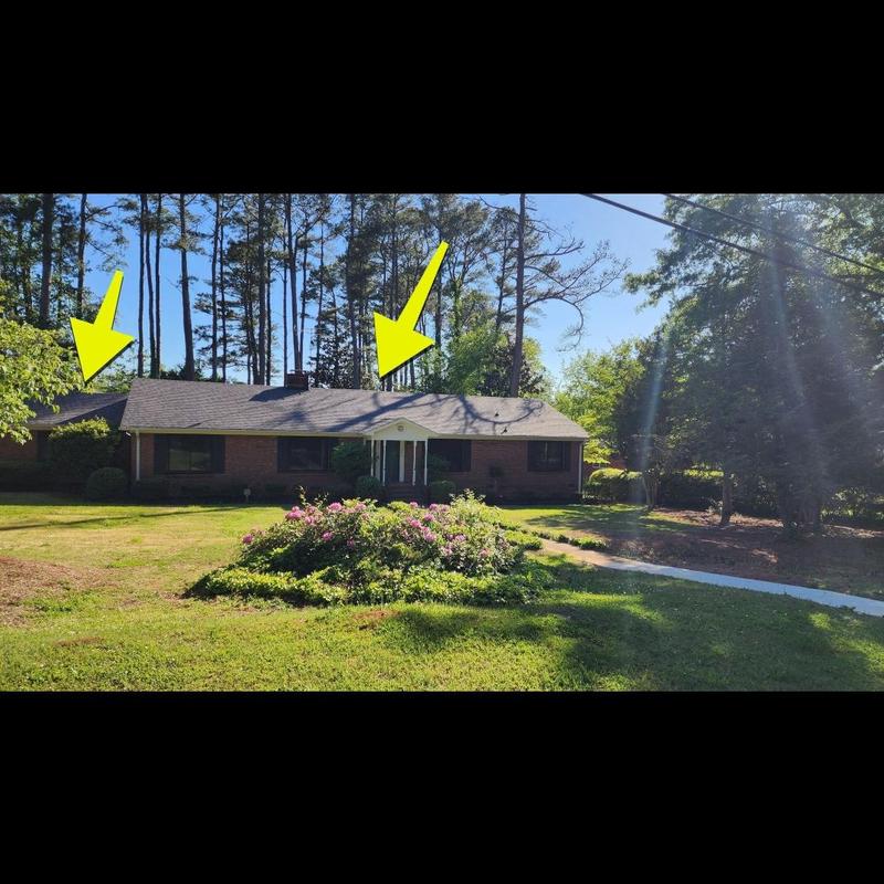 Asphalt shingle roof with storm damage arrows shown Asphalt shingle roof with storm damage arrows shown