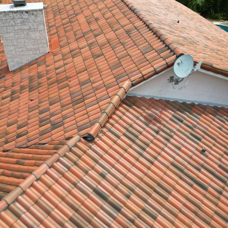 Concrete tile roof with satellite dish installation