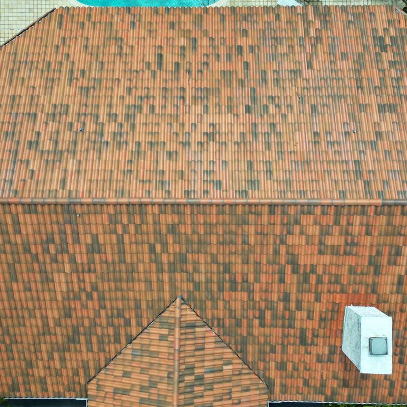 Concrete tile roof aerial view with vent pipe