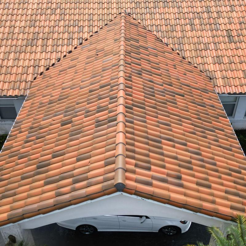 Concrete tile roof with ridge cap over carport