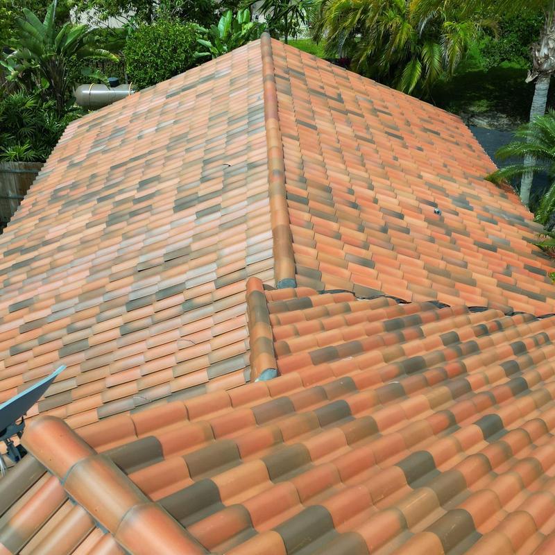 Concrete tile roof with ridge caps in Miami backyard