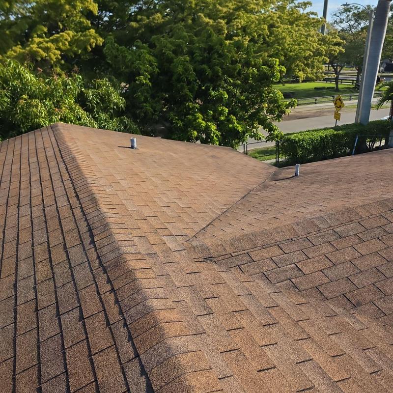 Shingle roof with ventilation pipes and valleys outdoors