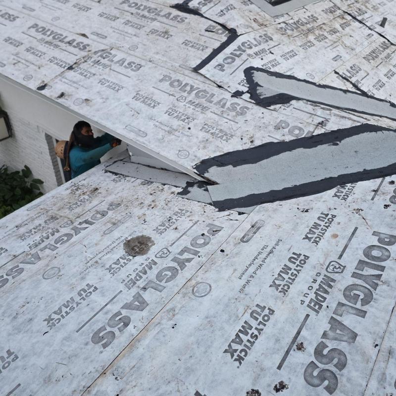 Roof underlayment installation on tile roof replacement