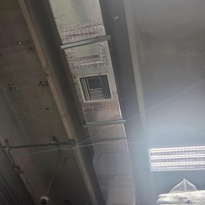 HVAC ductwork with vent in commercial ceiling HVAC ductwork with vent in commercial ceiling