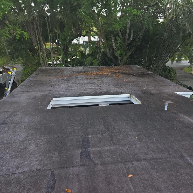 Flat roof with skylight opening and weathering