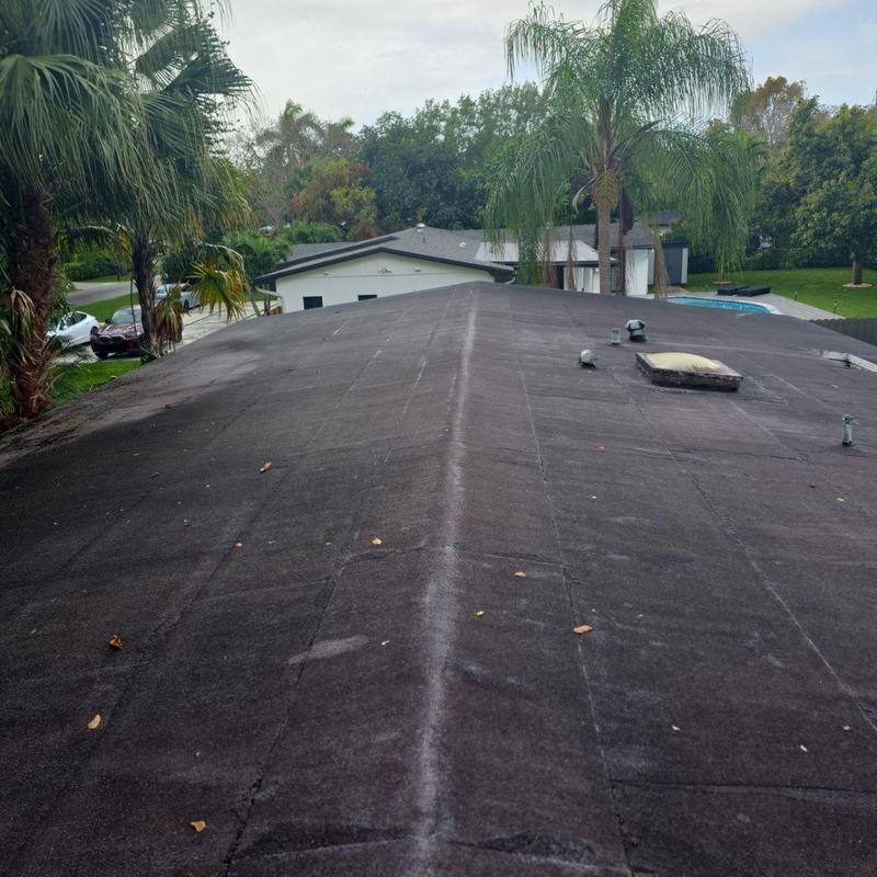 Flat roof with vents and skylight in residential area
