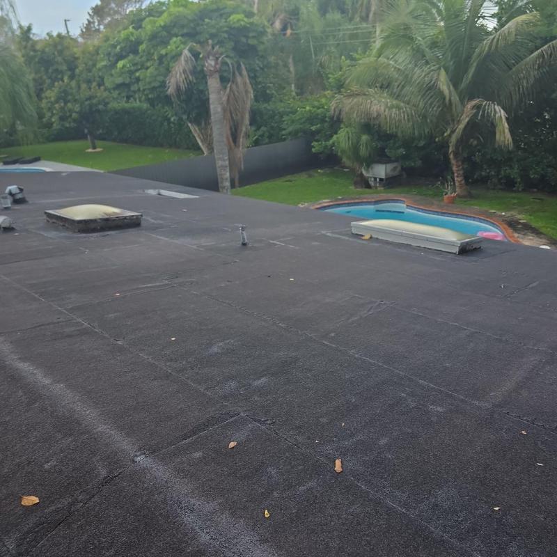 Flat roof with skylights and vent pipes