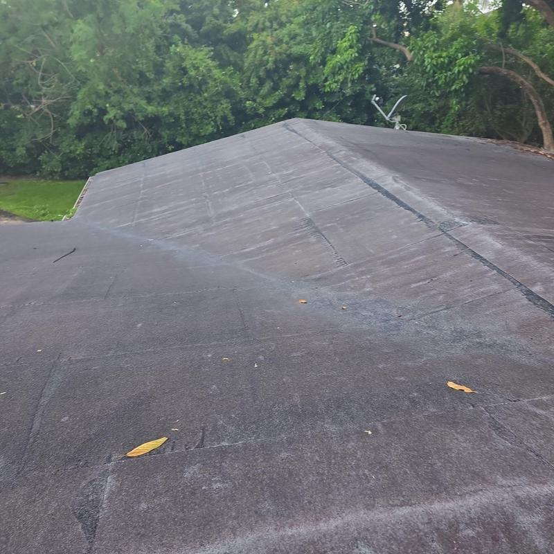 Flat roof surface showing wear and aging in Pinecrest