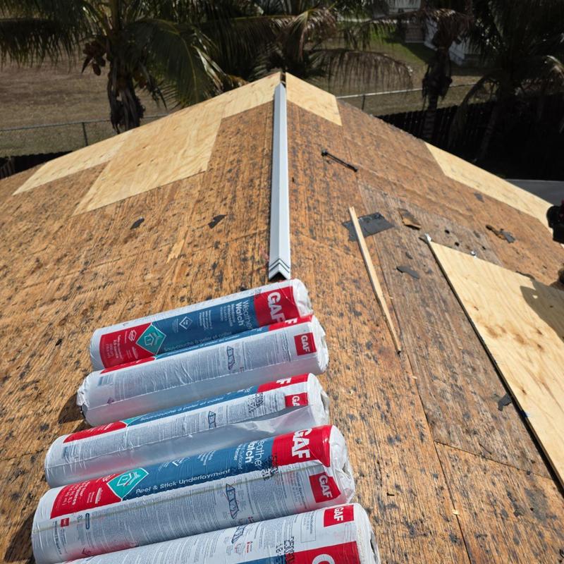 GAF underlayment rolls on shingle roof decking in Miami
