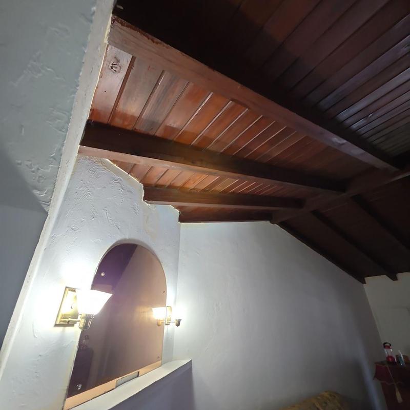 Wooden ceiling beams and paneling in interior room