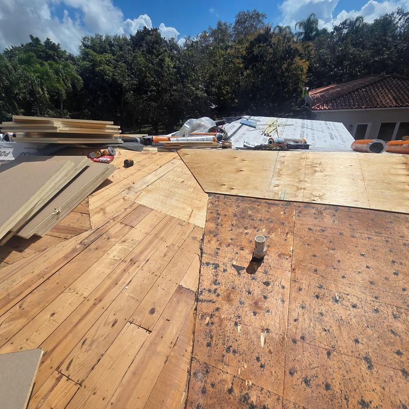 Plywood roof decking installation with underlayment rolls