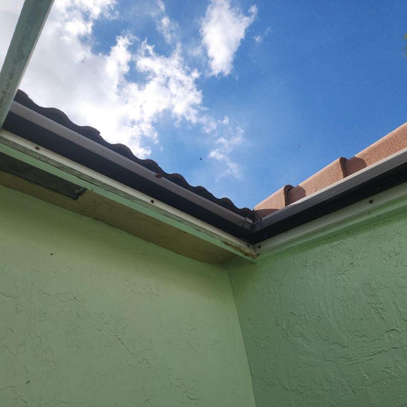 Concrete tile roof edge with gutter and soffit details