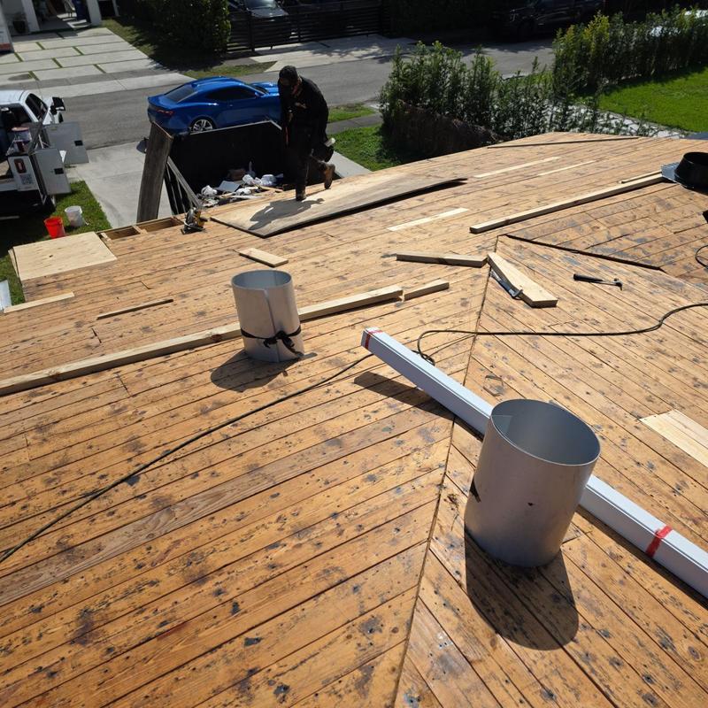 Wooden roof deck replacement with chimney vents