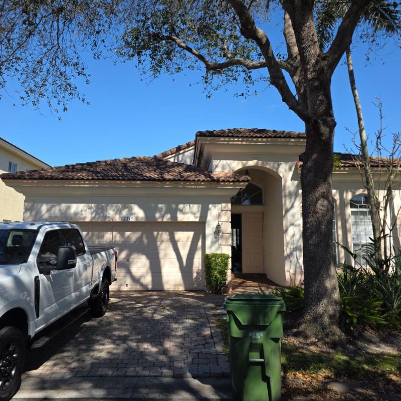 Concrete tile roof on residential house exterior in Miami