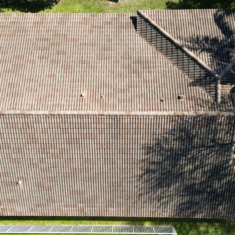Concrete tile roof with ridge vents and flashing