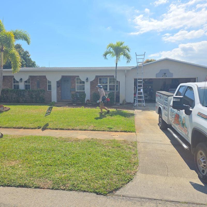 Flat and shingle roof replacement with ladder and truck