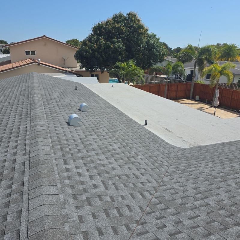 Shingle roof and flat roof replacement in Miami backyard