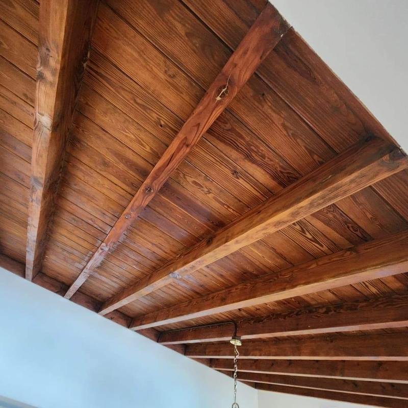 Wooden ceiling beams and planks in interior room
