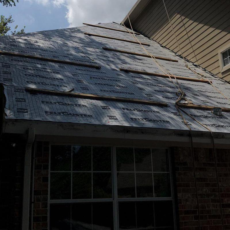 Roof underlayment installation on steep residential roof