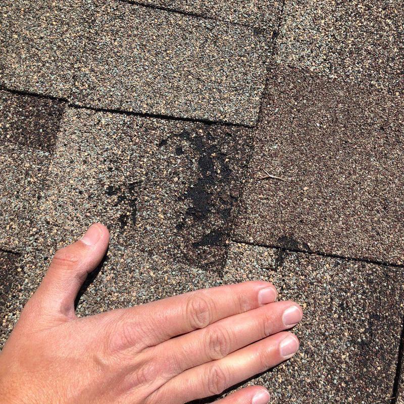 GAF Timberline shingles with hail damage close-up