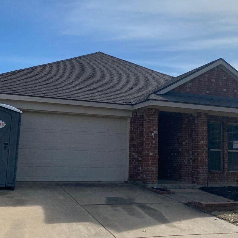 GAF Timberline shingle roof with new gutters and fence