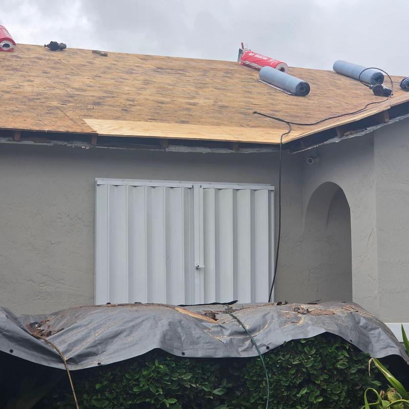 Roof sheathing installation with roofing underlayment rolls