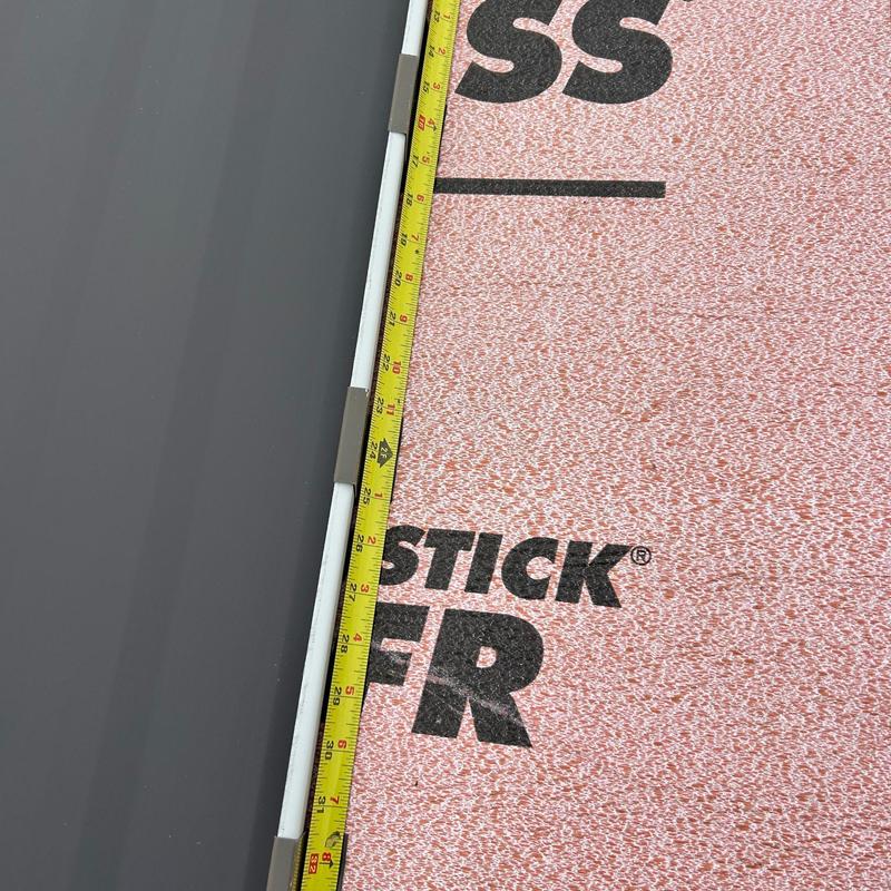Standing seam metal roof panel with tape measure