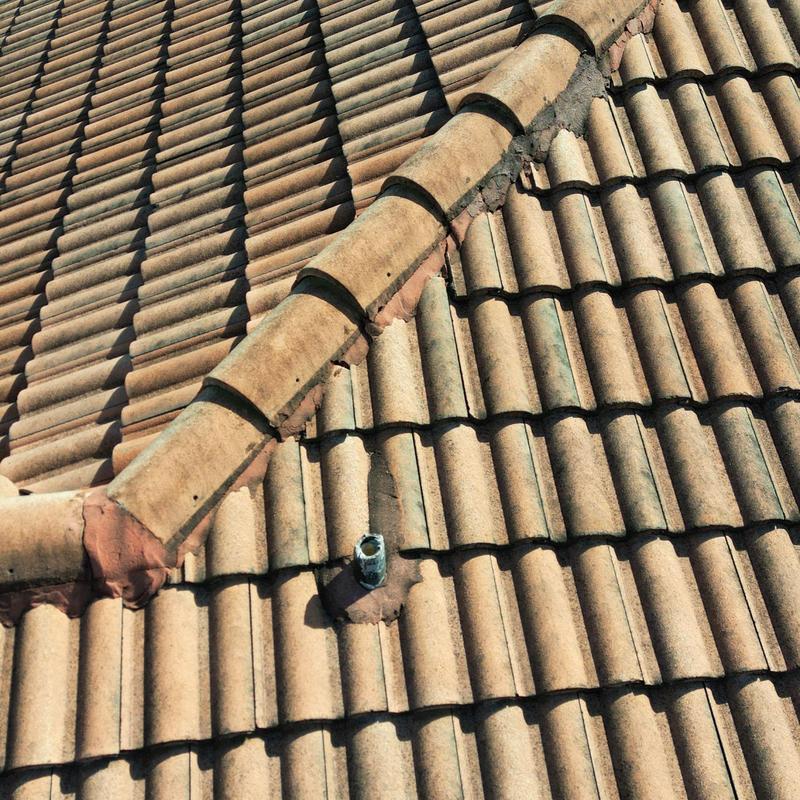 Concrete tile roof with vent pipe and ridge tiles