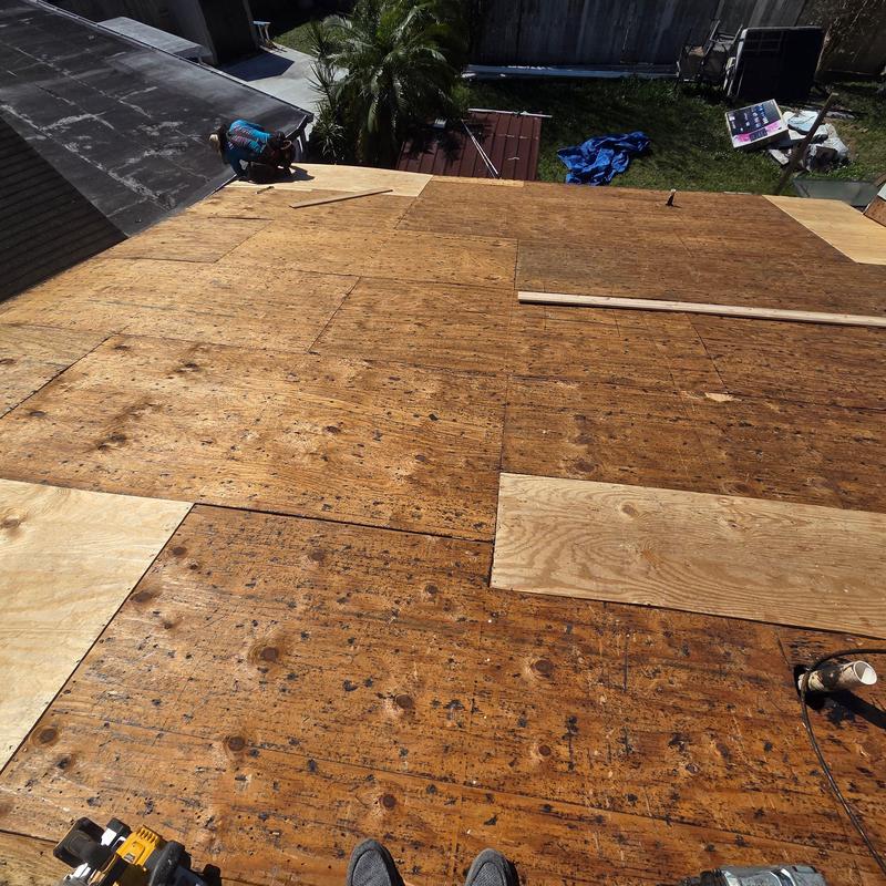 Roof decking installation with new plywood sheets