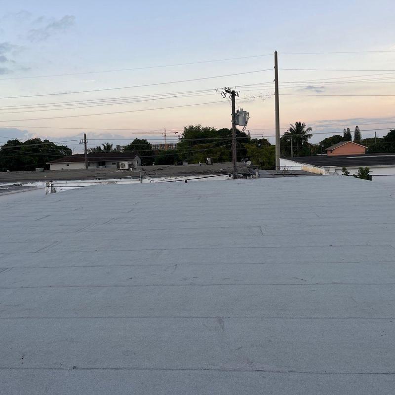 Flat commercial roof with new membrane installation Flat commercial roof with new membrane installation