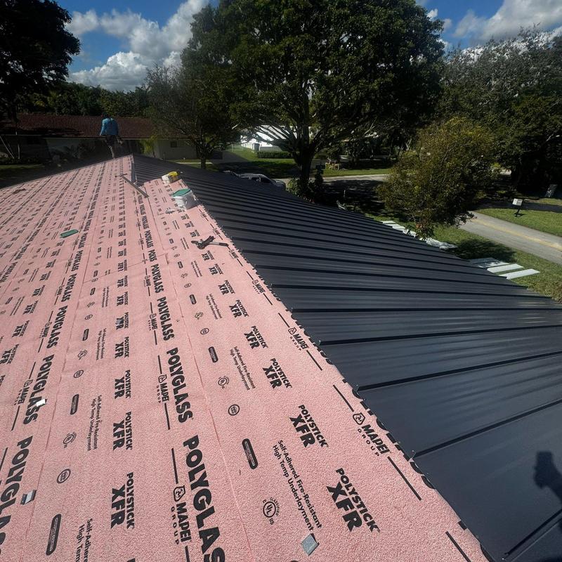 Standing seam metal roof with underlayment installation