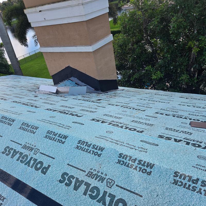 Concrete tile roof underlayment near chimney installation