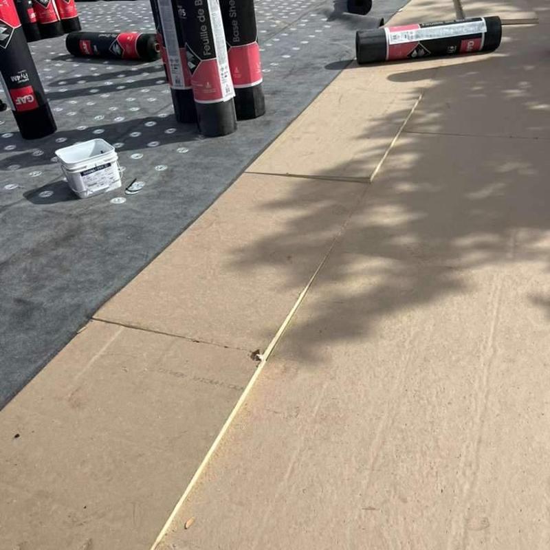 Flat roof insulation panels with roofing felt rolls Flat roof insulation panels with roofing felt rolls