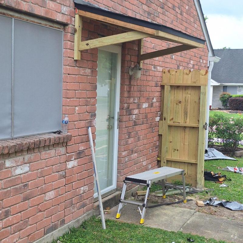Porch cover with treated lumber frame and shingles