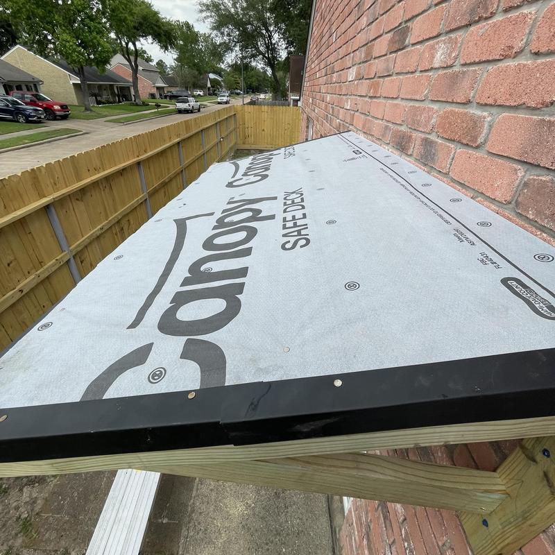 Porch roof decking with synthetic underlayment installation